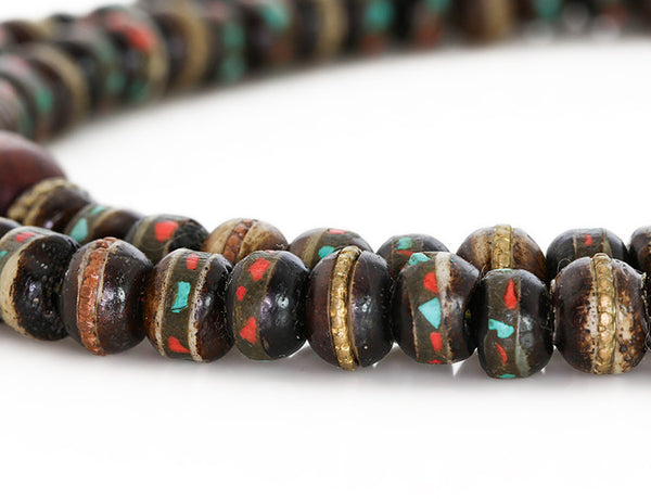 Mala beads with black inlaid bone close up
